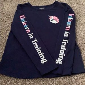 Unicorn in training shirt